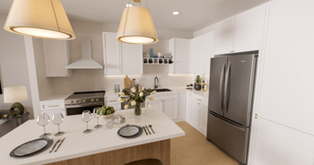 a white kitchen with stainless steel appliances and a white counter top at Lilia, Minnesota